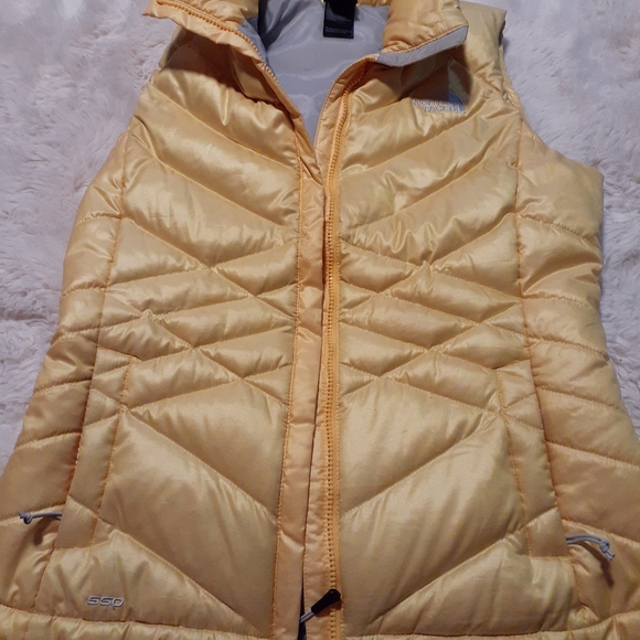 The North Face 550 down Vest.  Size small, yellow color - Picture 6 of 6